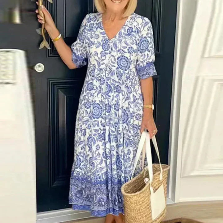 https://cdn.shopify.com/s/files/1/1039/3354/2745/files/wEdJRobe-longue-imprim-e-style-Boho-pour-femmes-tenue-de-plage-manches-courtes-d-contract-e_720x_cbde302a-374d-4db3-b4c0-4f213bb47d8d.webp?v=1776280315